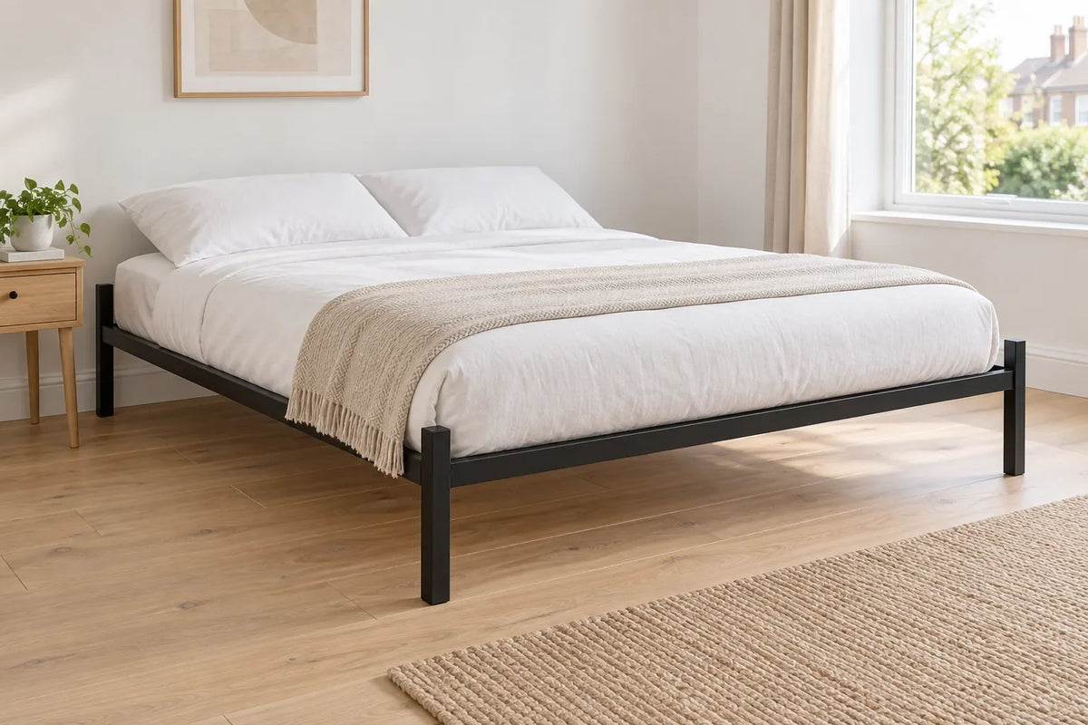 Callum super king heavy duty metal bed frame in black in a bright UK bedroom