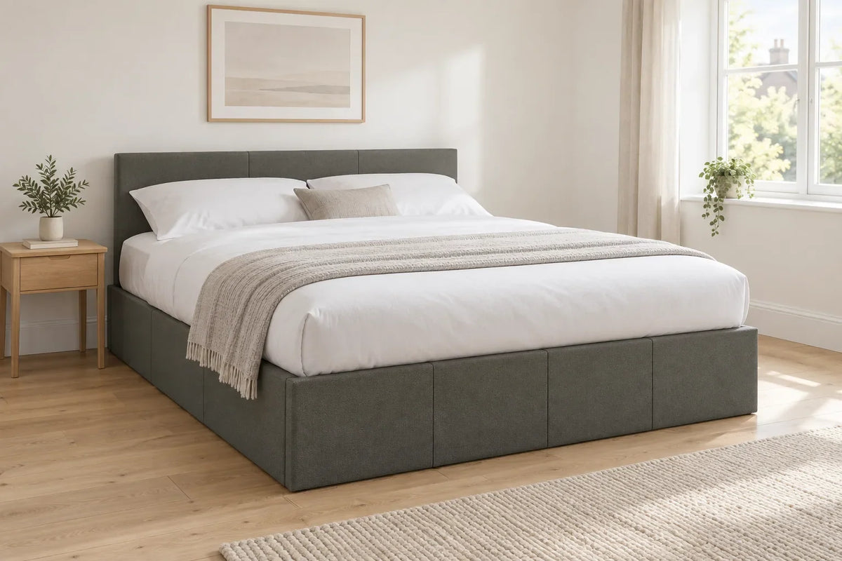 Pimlico grey side lift ottoman bed with a low headboard, shown in a bright UK bedroom