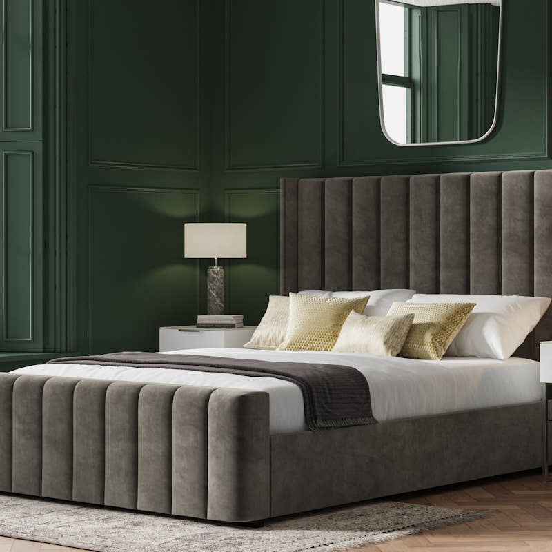 Stanmore velvet ottoman bed in mid grey velvet, closed, in a bedroom
