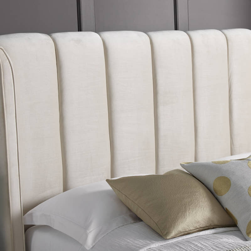 Holloway velvet ottoman bed in warmstone velvet, close-up of the art deco headboard