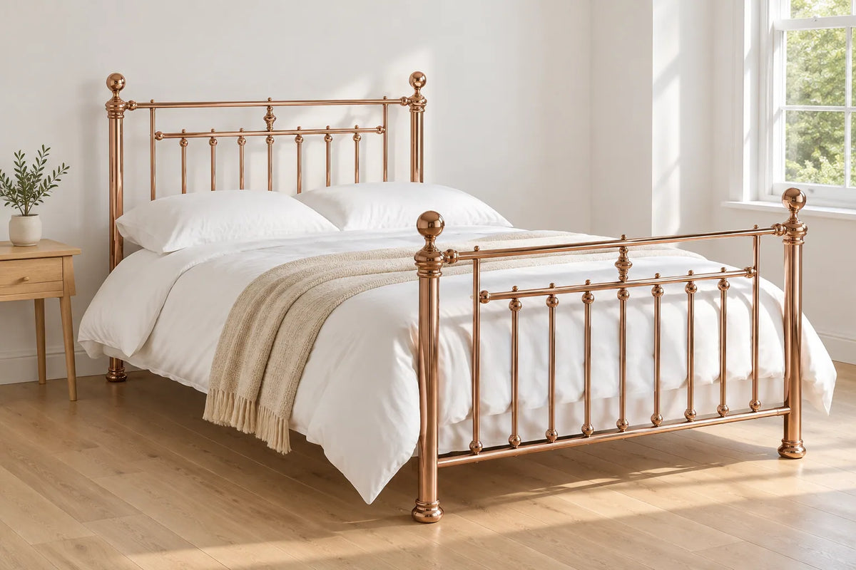Aurora rose gold Victorian style metal bed frame, shown in a bright UK bedroom