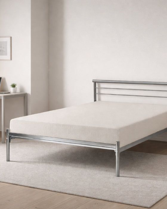 Bermondsey silver metal bed frame, in a bedroom with a desk