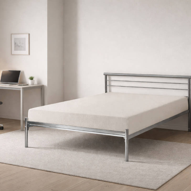 Bermondsey silver metal bed frame, in a bedroom with a desk