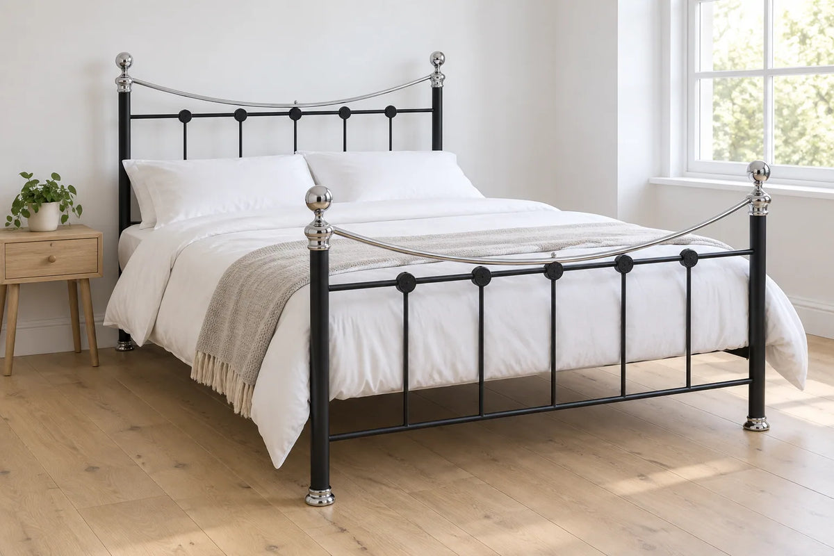 Brunel black steel metal bed frame, shown in a bright UK bedroom
