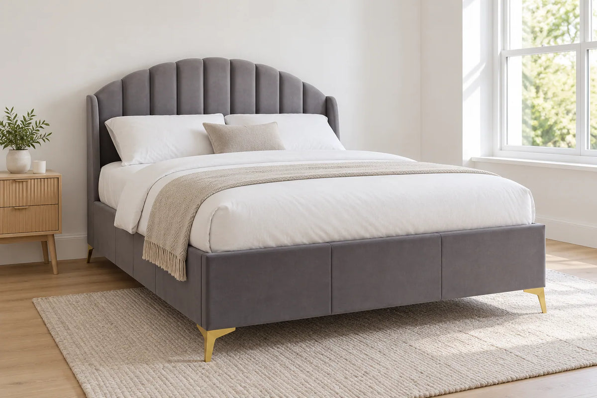 Chelsea grey ottoman bed with a tall padded headboard, shown in a bright UK bedroom
