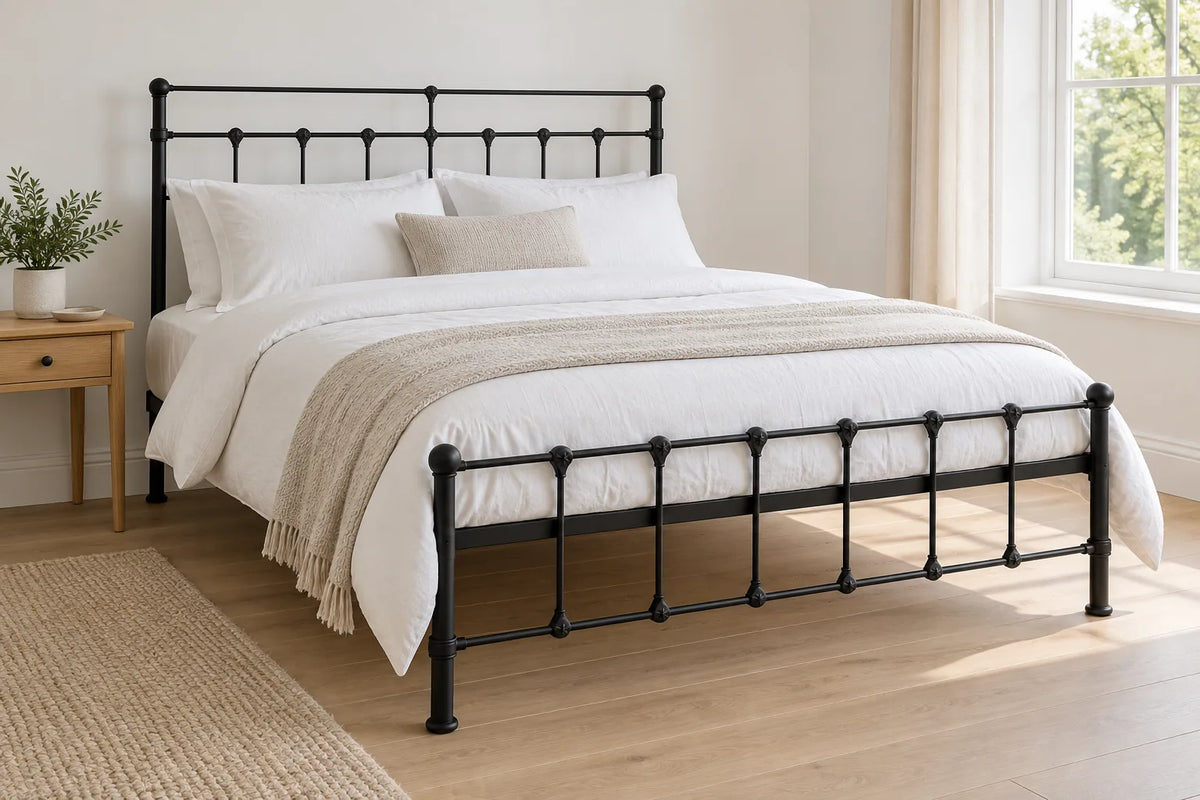 Clapham black iron bed frame, shown in a bright UK bedroom