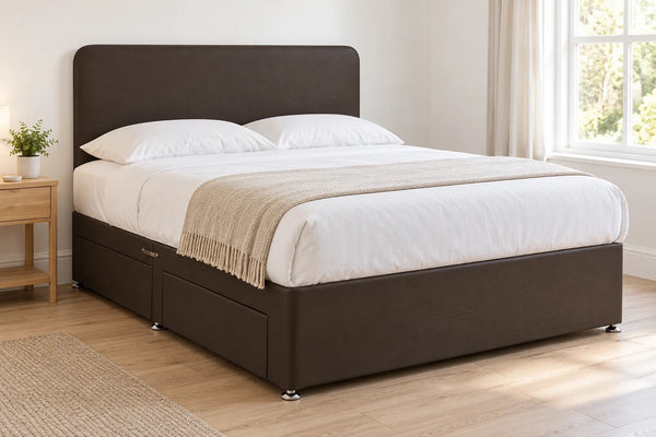 Brown faux leather divan bed base with 2 drawers and a curved headboard, in a bright UK bedroom (bedding for illustration, mattress not included)