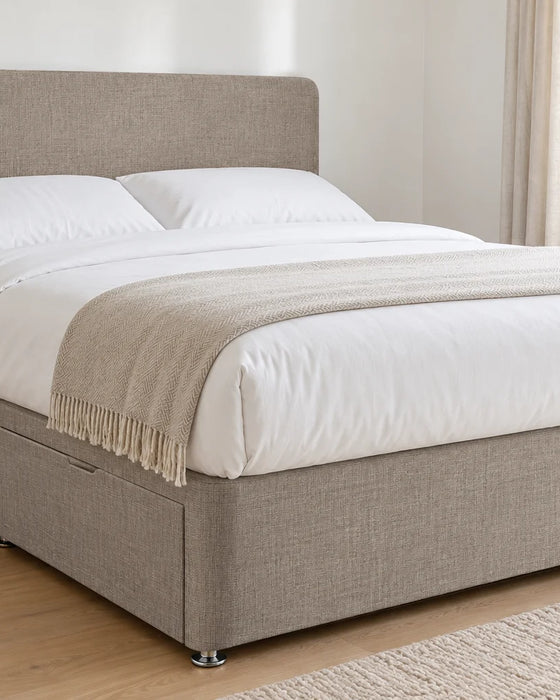 Slate linoso divan bed base with 2 drawers and a curved headboard, in a bright UK bedroom (bedding for illustration, mattress not included)