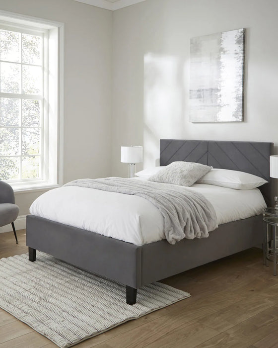 Hoxton ottoman bed frame in grey velvet with a chevron headboard