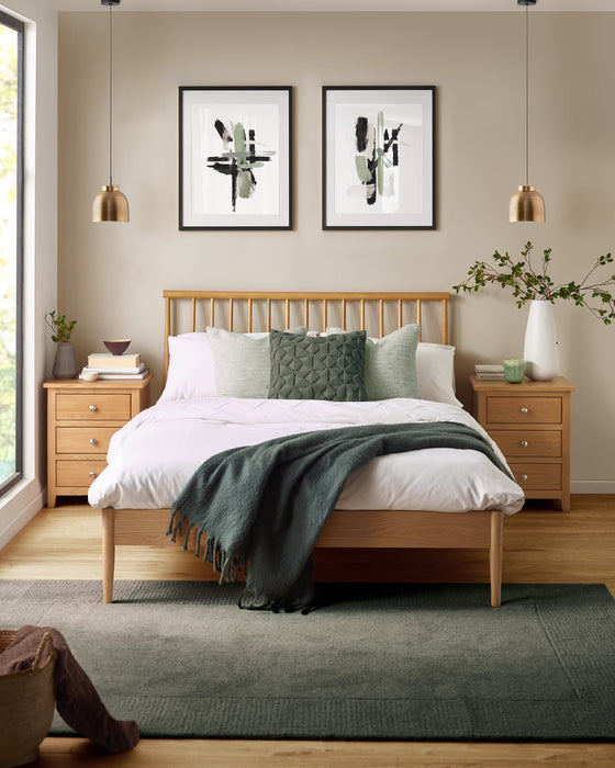 Julian Bowen Belton oak spindle bed, in a bedroom