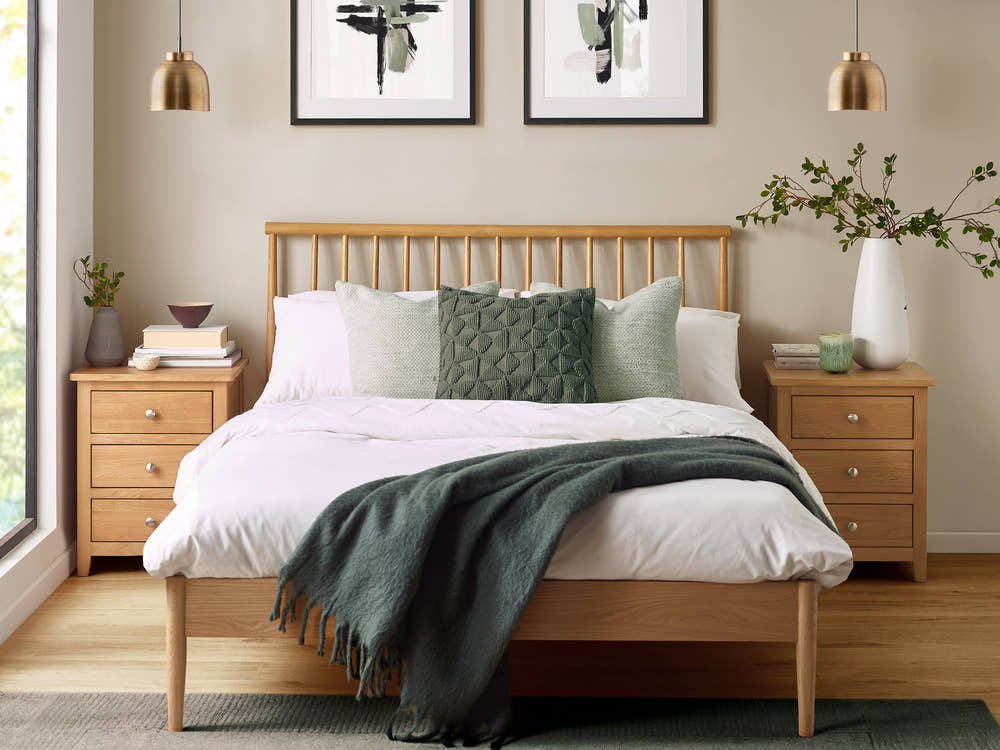 Julian Bowen Belton oak spindle bed, in a bedroom