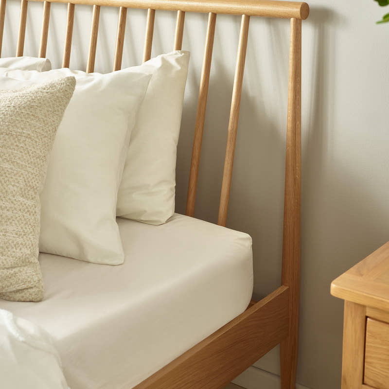 Belton bed: the slanted oak spindles of the headboard, close up