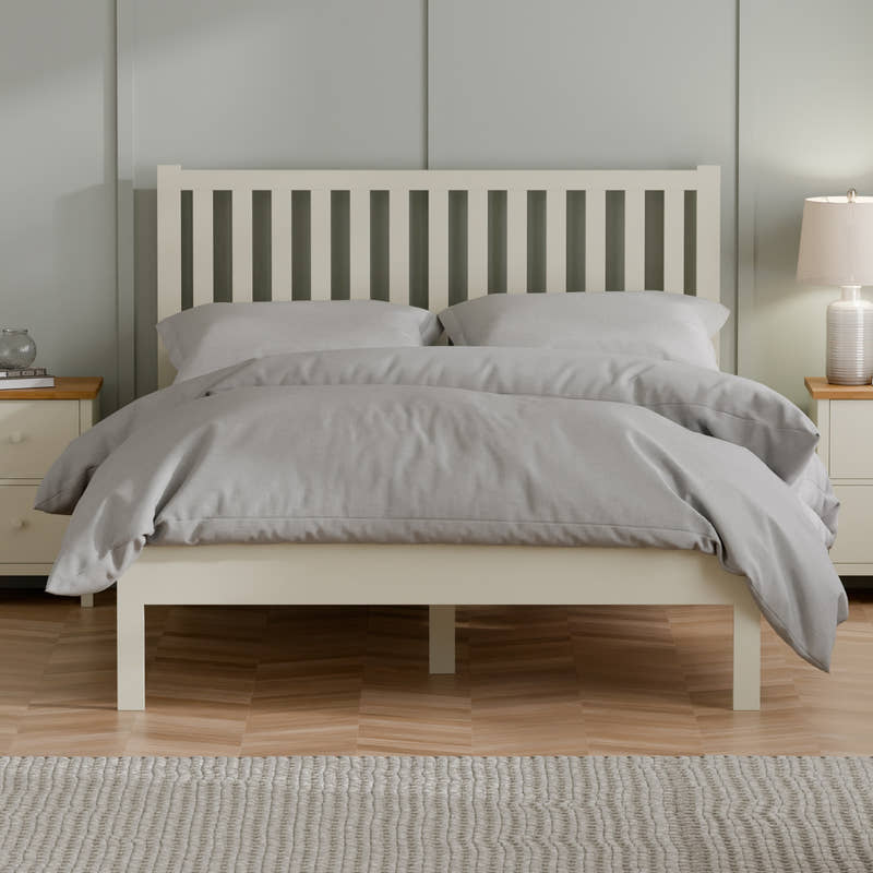 Julian Bowen Coxmoor bed in ivory with a tall slatted headboard, in a bedroom