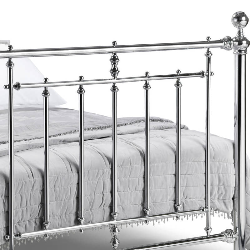 Julian Bowen Empress chrome footboard with ball finial posts and decorative collars, close up