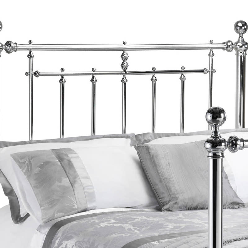 Julian Bowen Empress chrome headboard with ball finials and turned spindles, close up