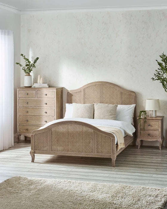 Julian Bowen Fleur rattan bed in limed oak, in a bedroom