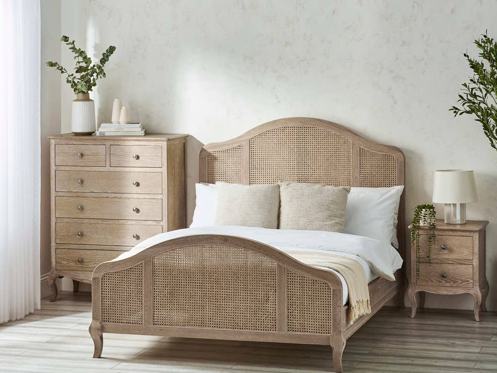 Julian Bowen Fleur rattan bed in limed oak, in a bedroom