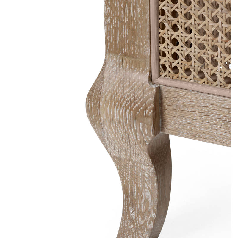 Fleur bed: curved limed oak leg and cane panel, close up
