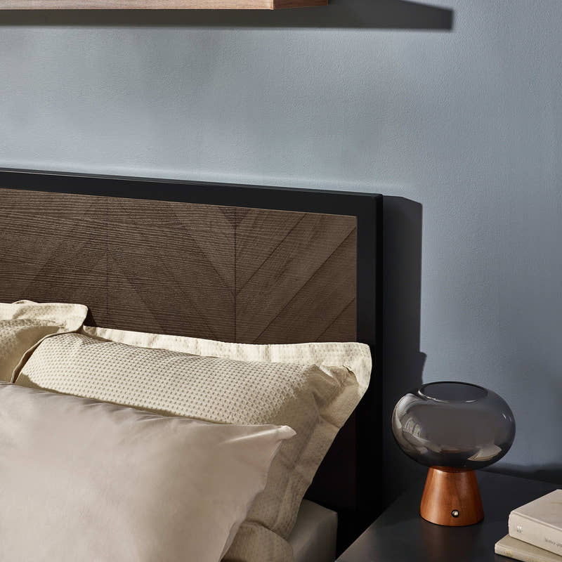 Harrison bed: herringbone headboard panel and black frame, close up