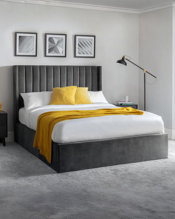 Julian Bowen Langham grey velvet ottoman bed with a tall channelled headboard, in a bedroom