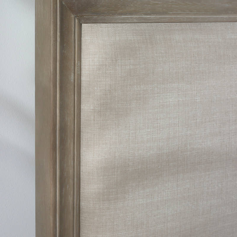 Lucie bed: limed oak border around the linen headboard, close up
