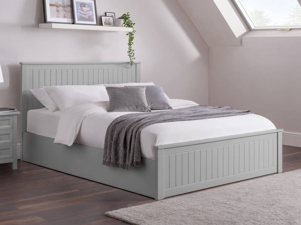 Julian Bowen Maine ottoman bed in dove grey, made up in a loft bedroom