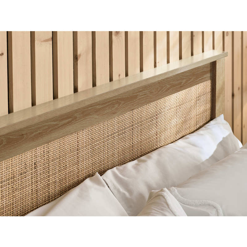 Padstow ottoman bed: woven rattan headboard panel in an oak effect frame, close up