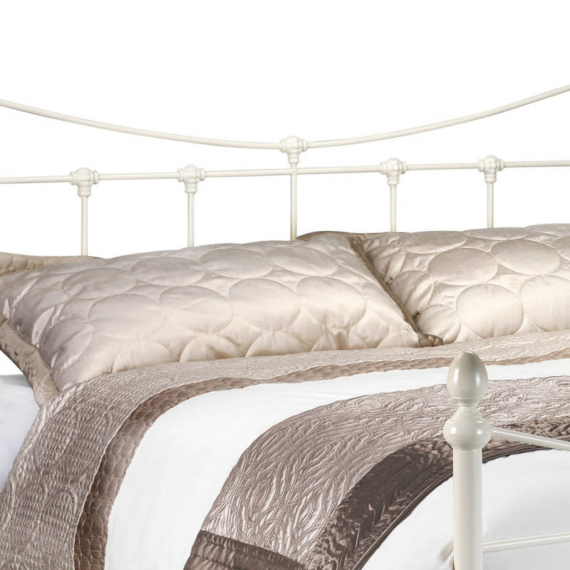 Julian Bowen Rebecca stone white metal headboard with a curved top rail and finials, close up