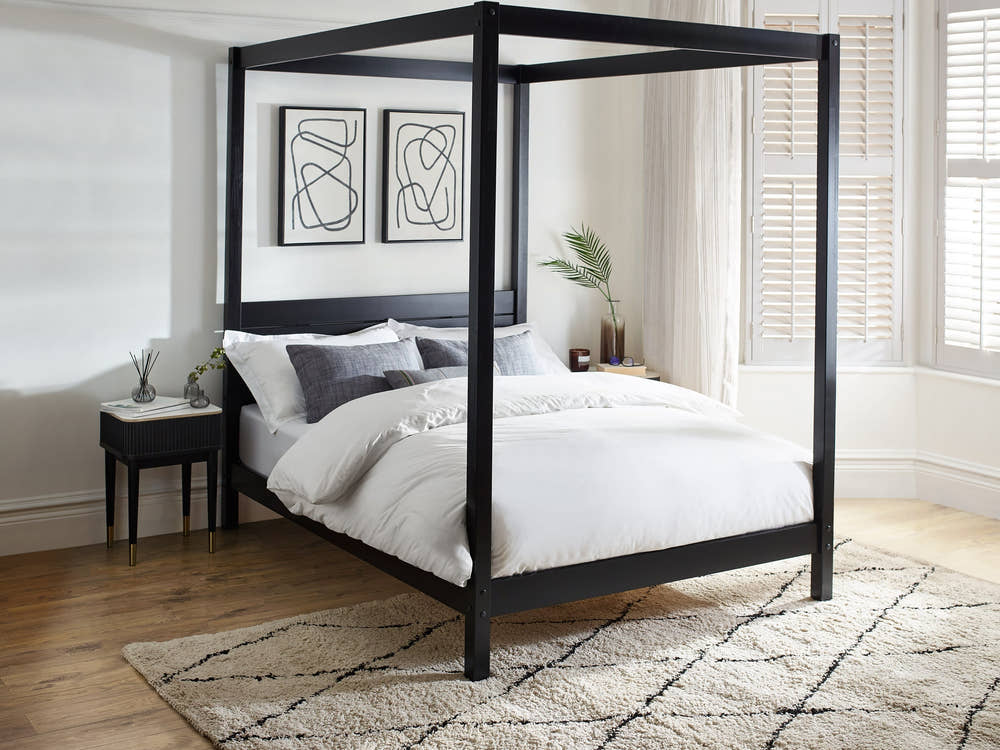 Julian Bowen Roxanne black canopy bed, in a bedroom
