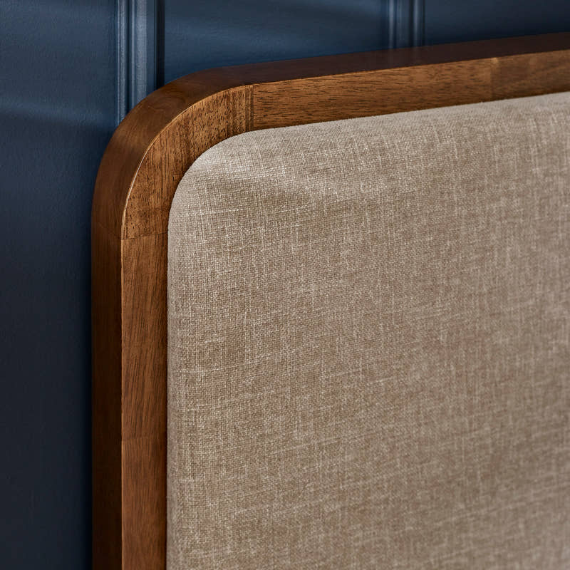 Walden bed: grey chenille headboard and walnut effect frame, close up