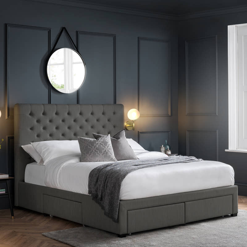 Julian Bowen Wilton 4 drawer bed in dark grey, in a dark panelled bedroom