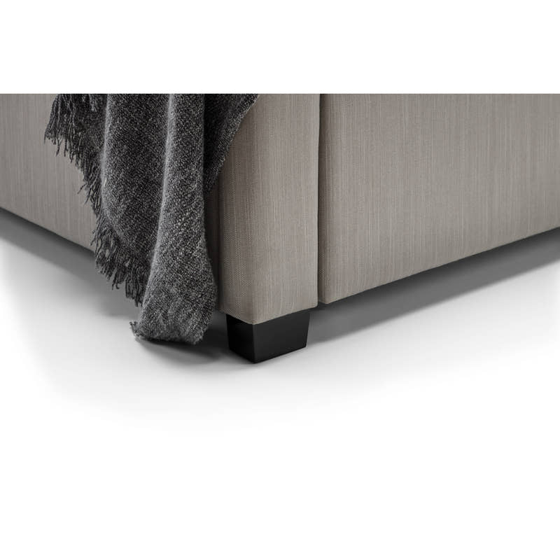 Wilton bed: corner of the light grey base and dark foot, close up