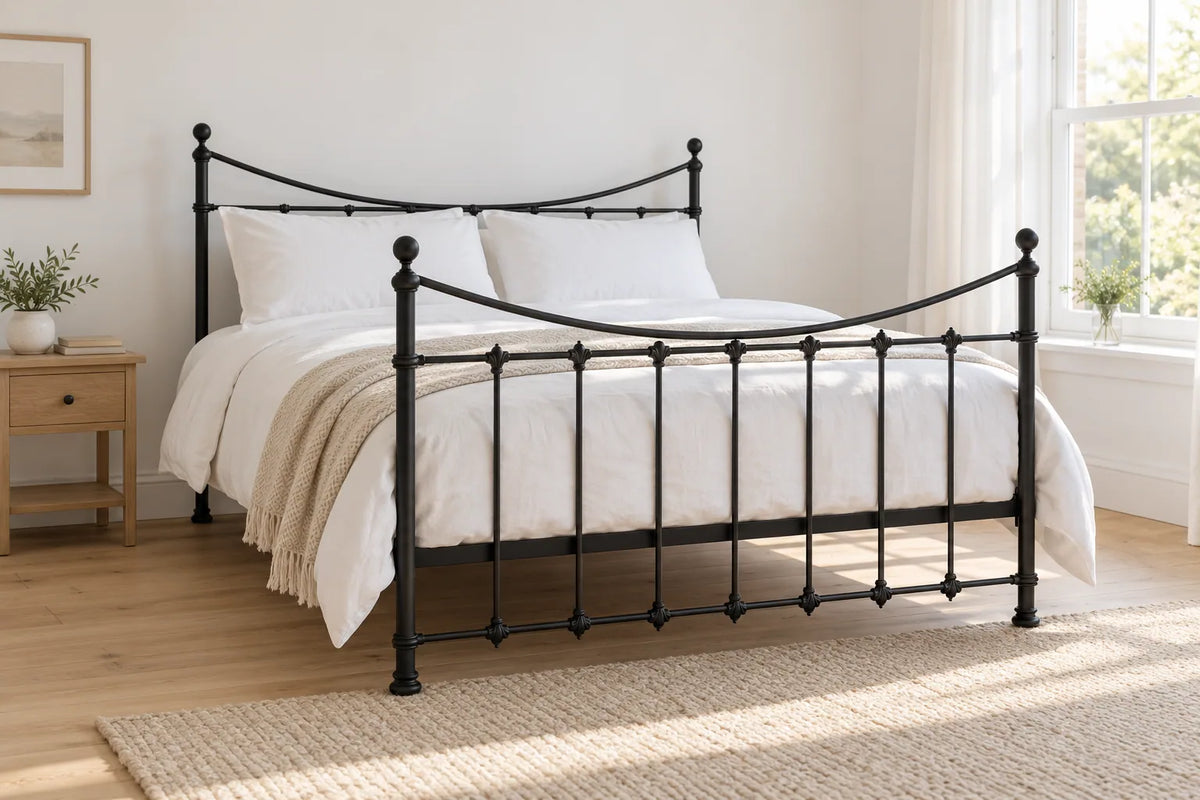 Kennington black iron bed frame, shown in a bright UK bedroom