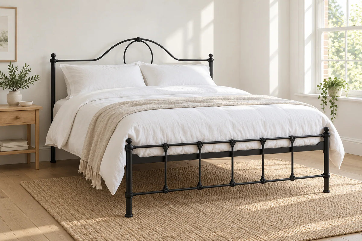 Lambeth black iron bed frame, shown in a bright UK bedroom