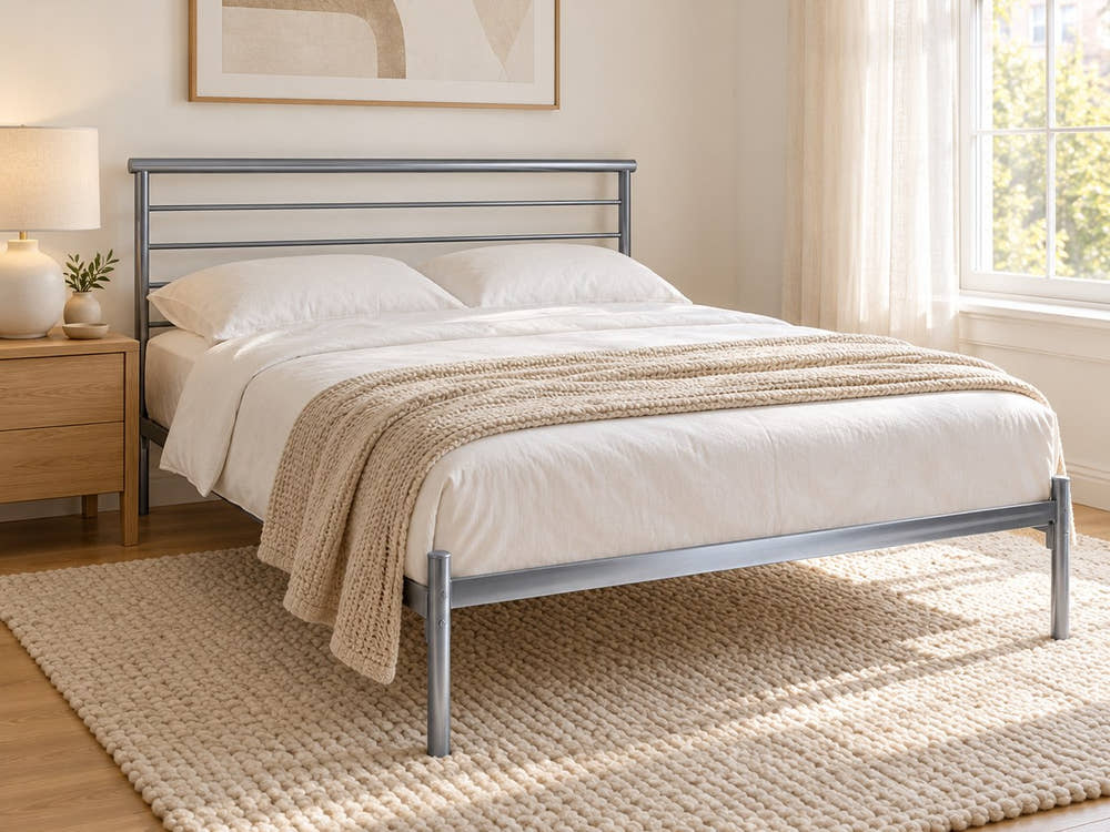 Bermondsey silver metal bed frame, in a bright bedroom (AI-generated illustration of this frame; bedding for illustration, mattress not included)