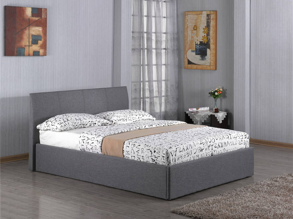 Harlesden grey fabric ottoman bed with the base closed, in a bedroom