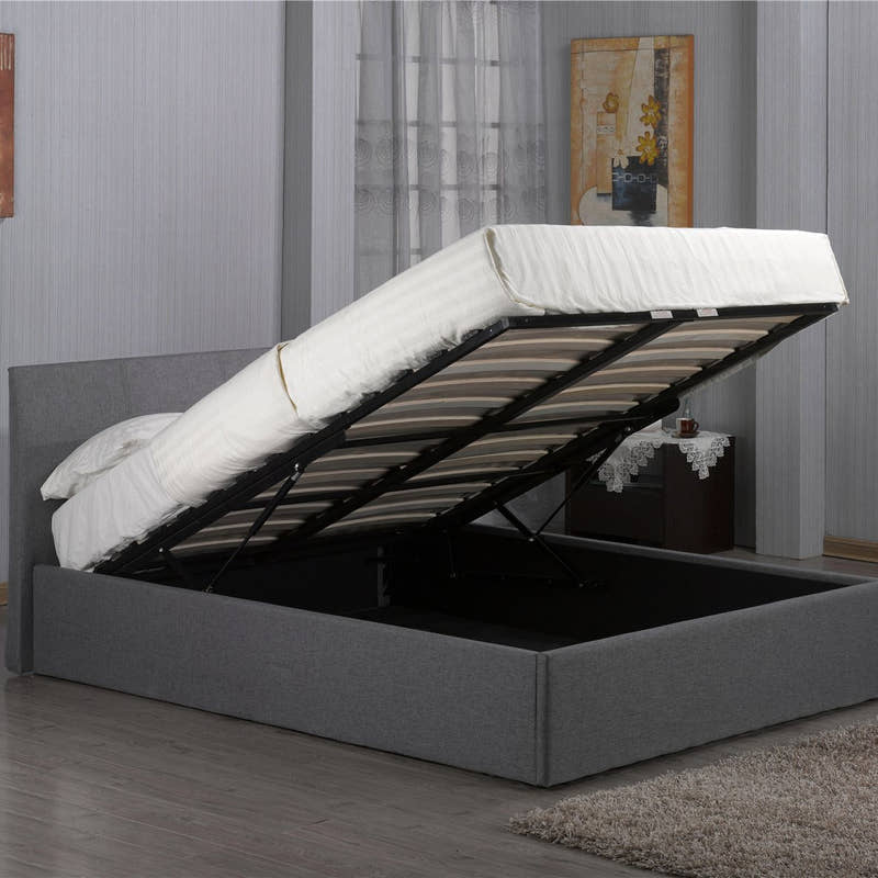 Harlesden grey fabric ottoman bed with the base lifted to show the storage