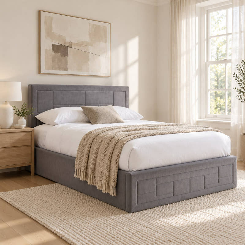 Holland grey velvet ottoman bed with a panelled headboard, in a bright bedroom (AI-generated illustration of this frame; bedding for illustration, mattress not included)
