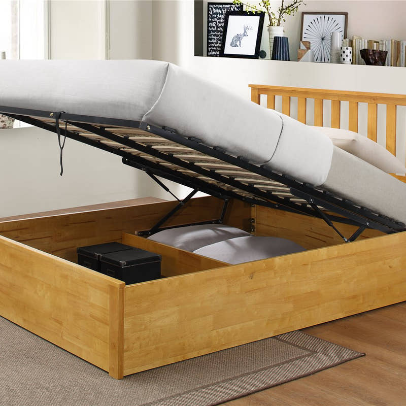 Morden ottoman bed in oak with the base lifted to show the storage