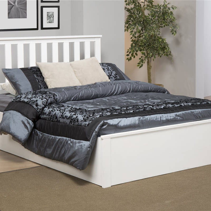 Morden solid rubberwood ottoman bed in white, in a bedroom