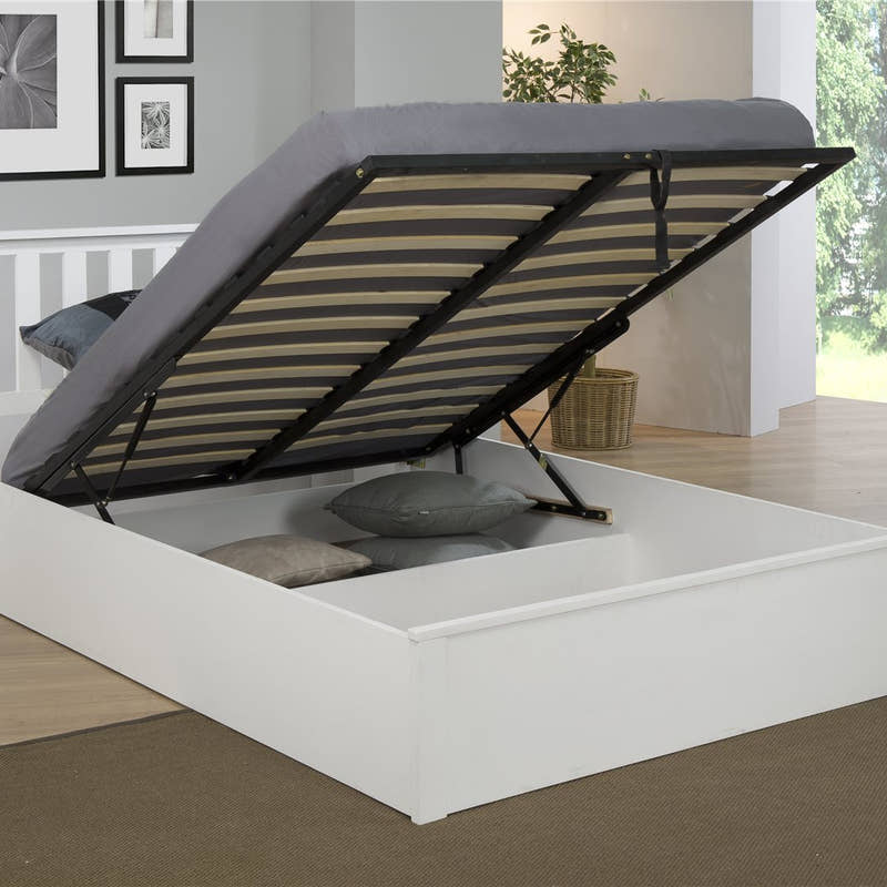 Morden ottoman bed in white with the base lifted to show the storage