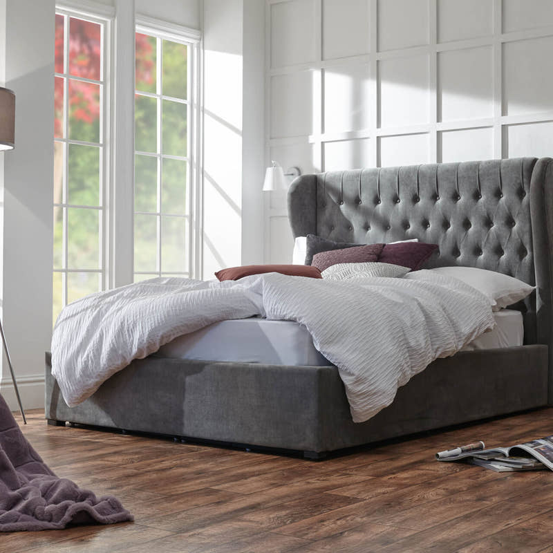 Sloane ottoman bed frame with a tall buttoned headboard in pewter chenille