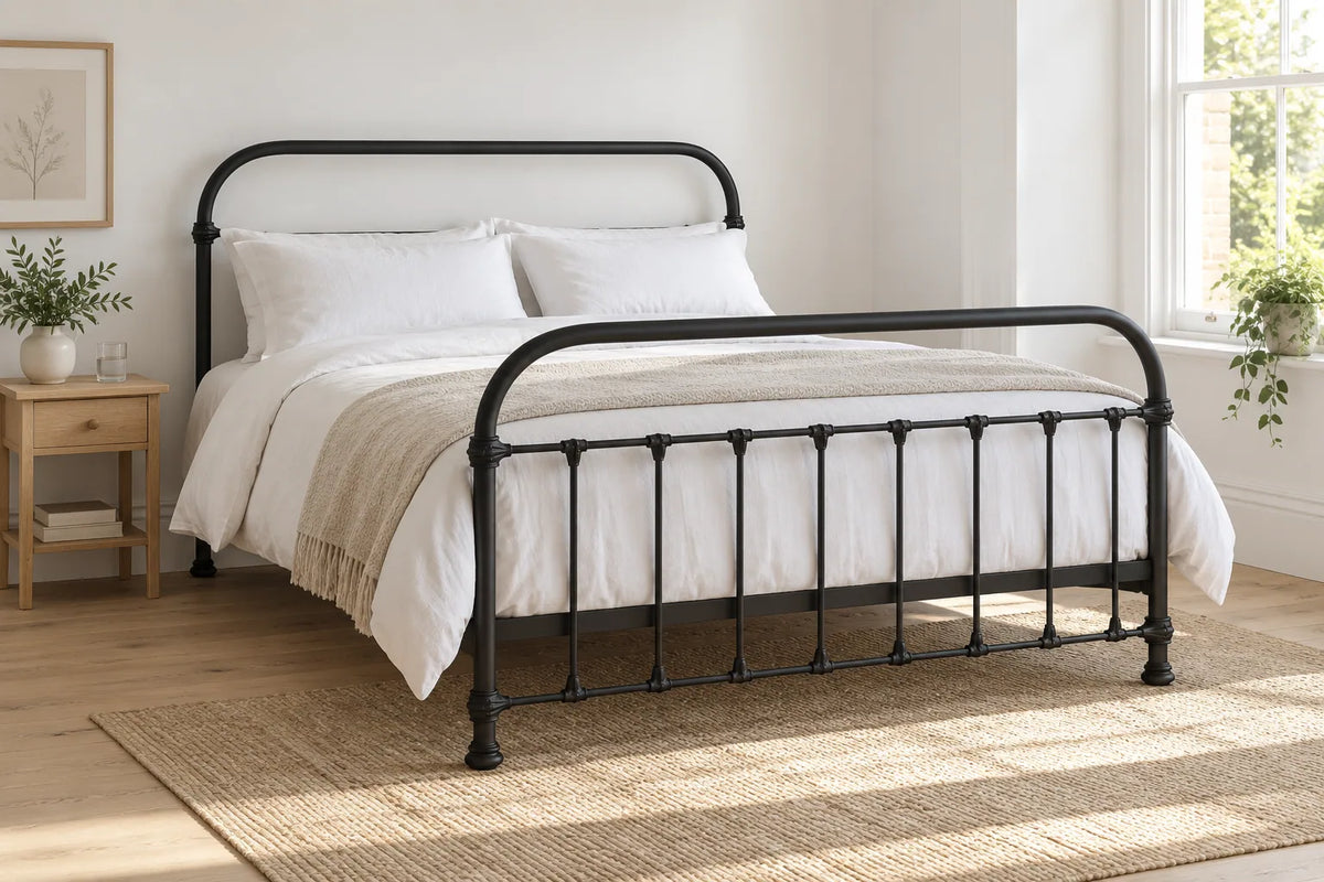 Streatham black iron bed frame, shown in a bright UK bedroom