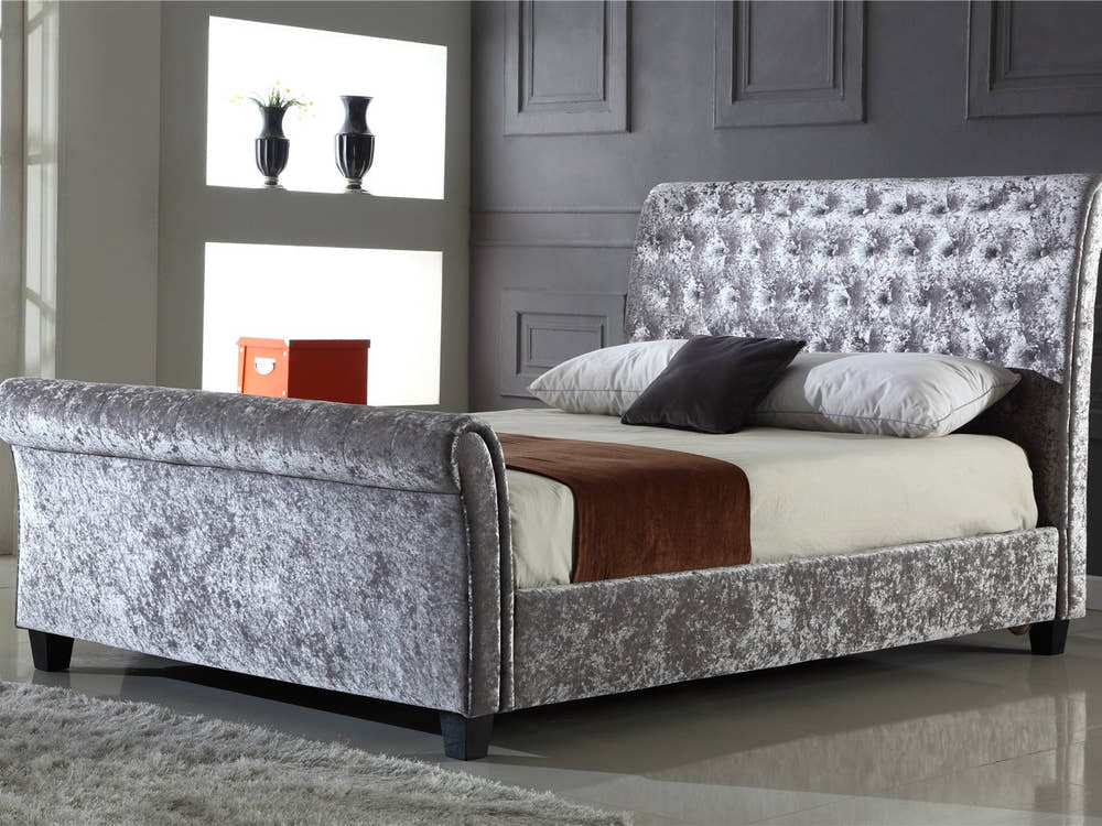 Kensington silver crushed velvet sleigh bed in a bedroom