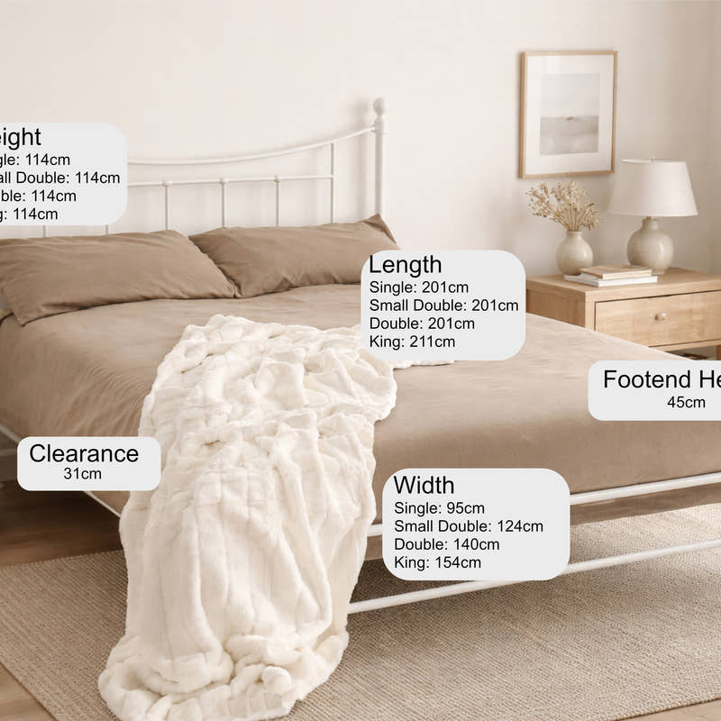 Walthamstow metal bed frame with a low foot end, in ivory, in a bedroom with its height, width and clearance marked