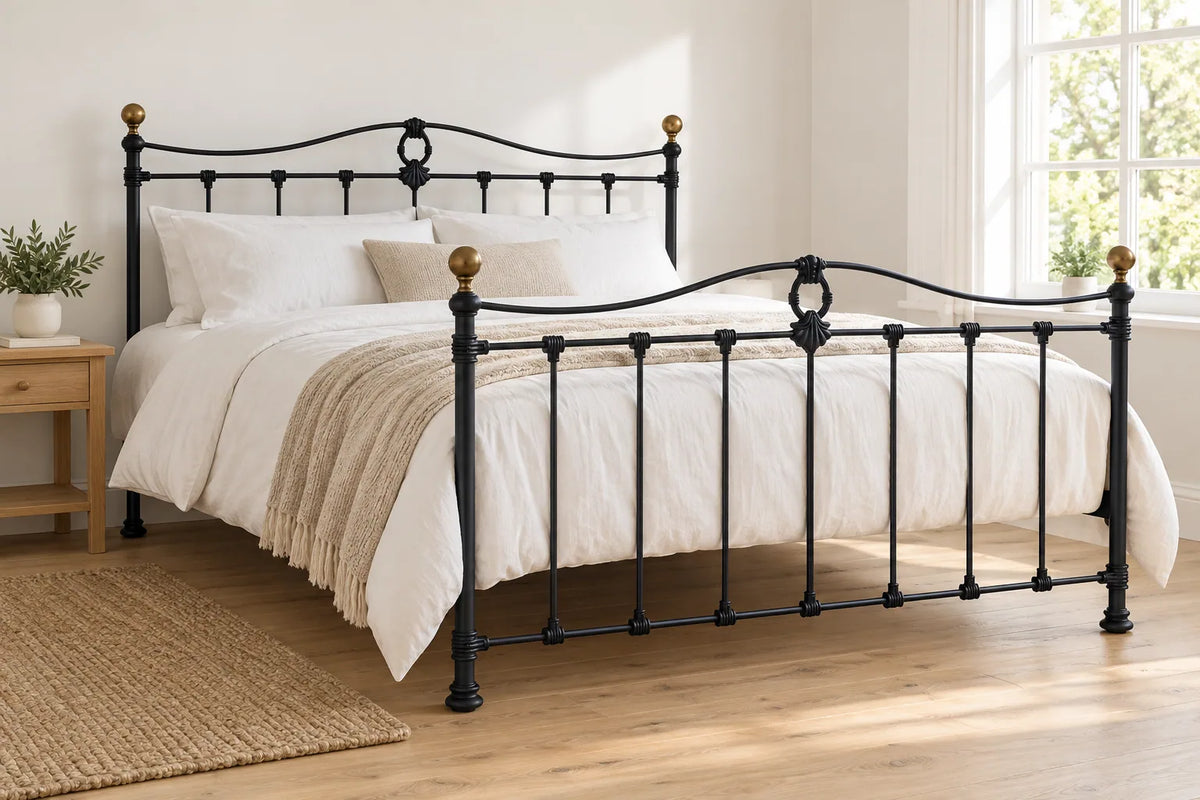 Wapping black iron bed frame, shown in a bright UK bedroom