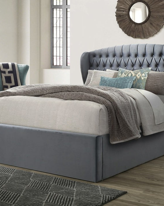 Lewisham velvet ottoman bed in grey velvet, closed, in a bedroom