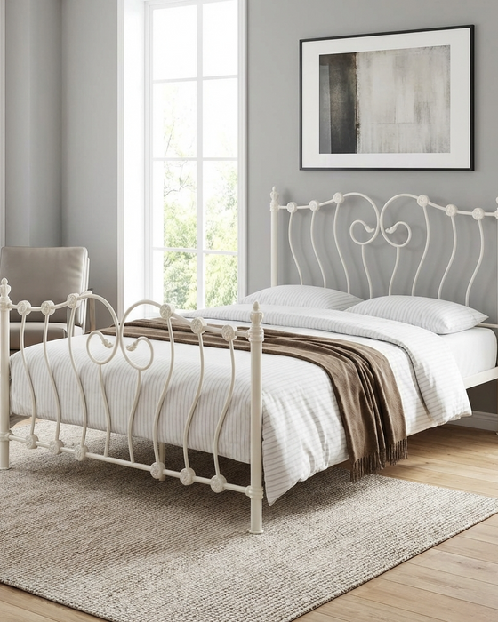 Inova ivory metal bed frame with decorative swirl detailing