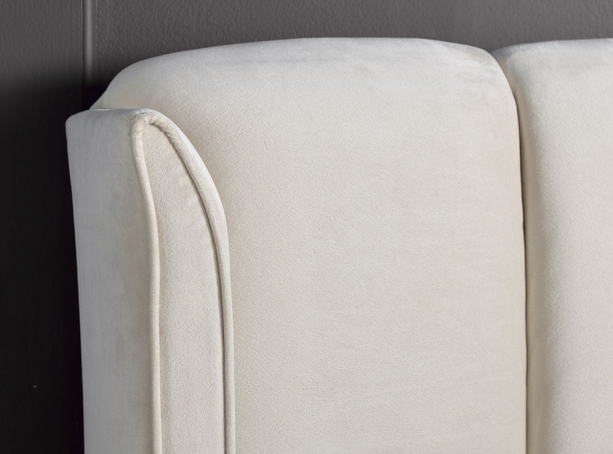 Holloway velvet ottoman bed in warmstone velvet, detail of the headboard wing