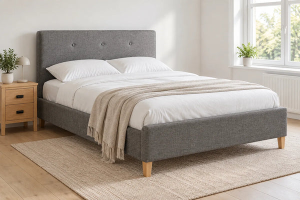 Battersea grey upholstered bed frame, shown in a bright UK bedroom
